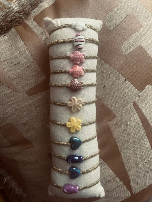 Golden charm bracelets